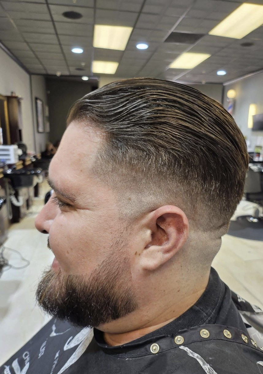 Slicked-back fade with beard